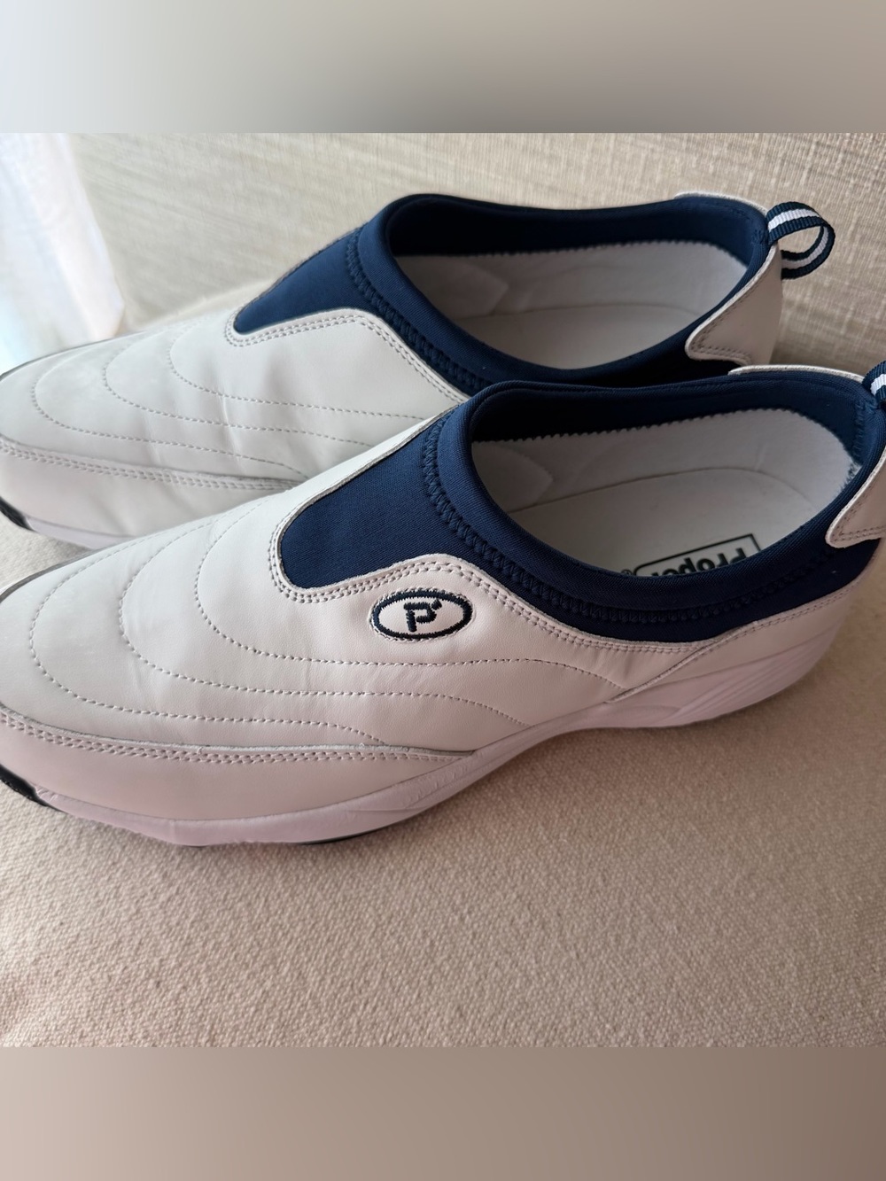 Propet Mens Slip-On Sneakers in White and Navy
